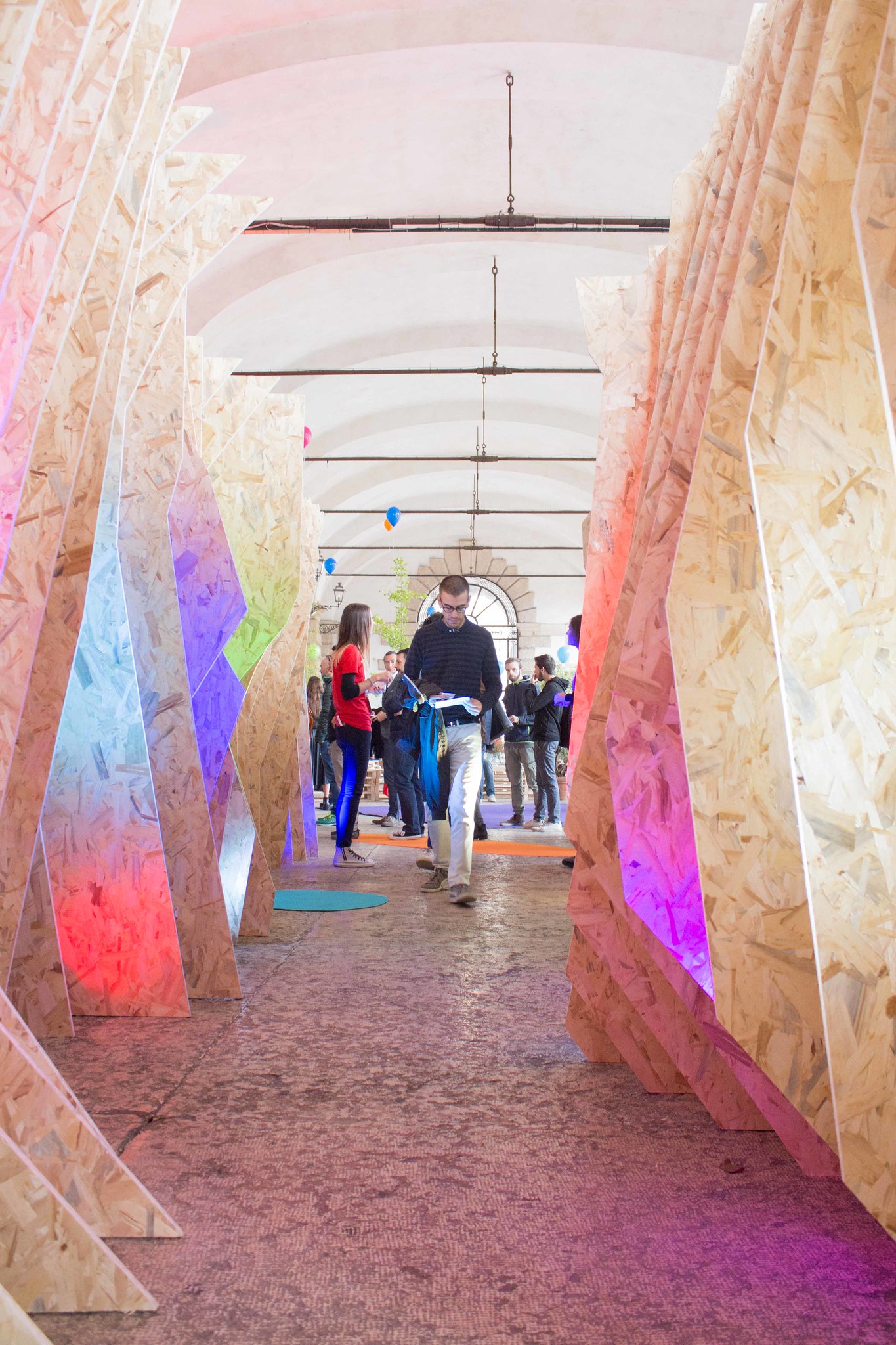 Colorful lit corridor with OSB panels
