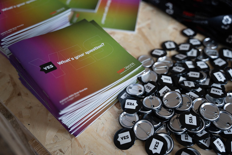 TEDxVerona booklets and YES pins