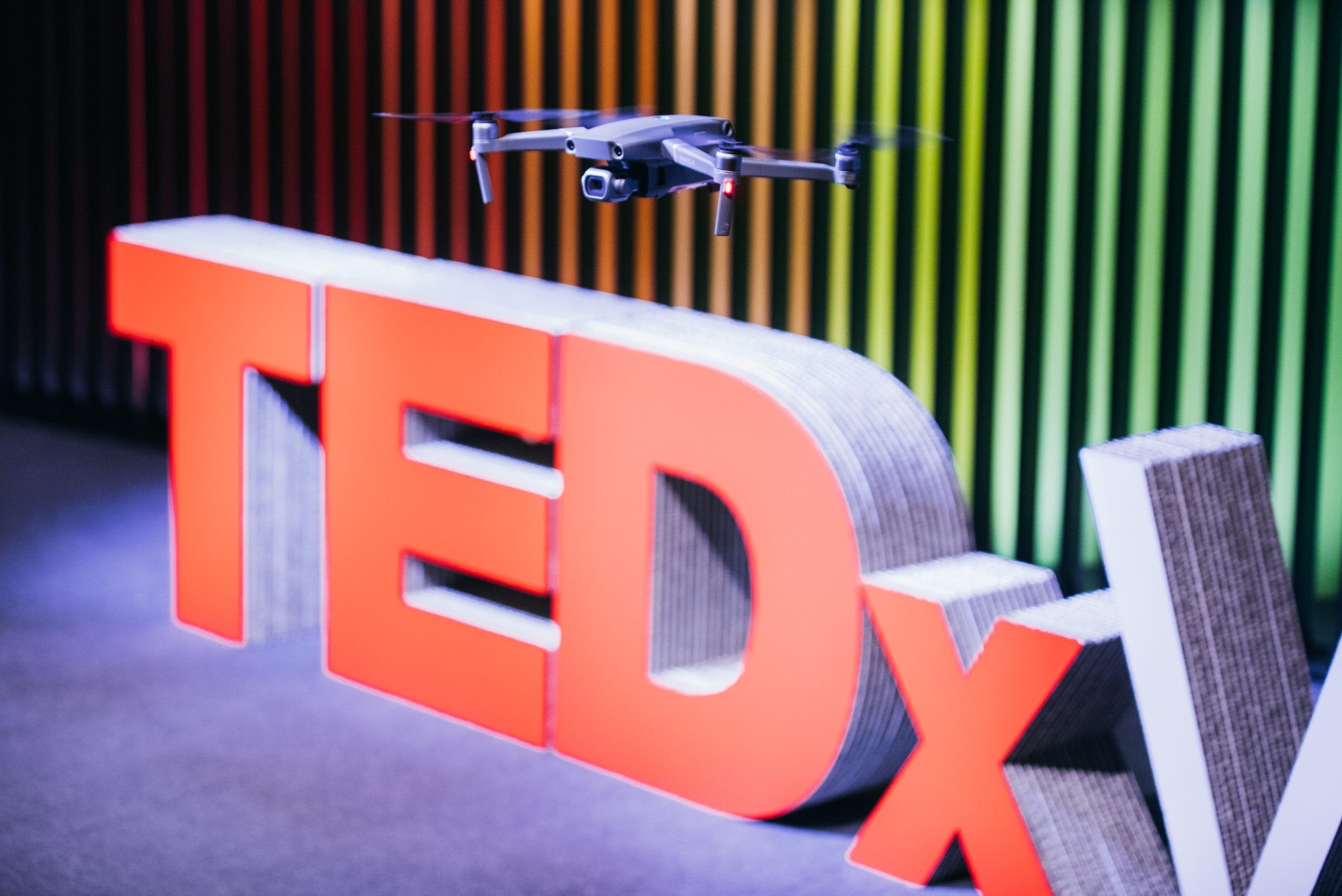 TEDx letters with drone and colorful background